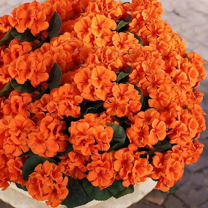 Hananona 12 Pcs Artificial Geranium Flowers for Outdoors Geranium Silk Orange Flower Outdoor UV Resistant Patio Plants Faux Autumn Flowers for Fall Home Kitchen Table Centerpieces (12, Orange)